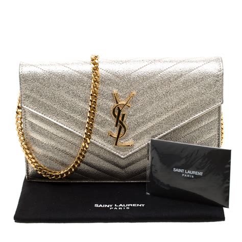 ysl gold monogram clutch|ysl monogram clutch beige.